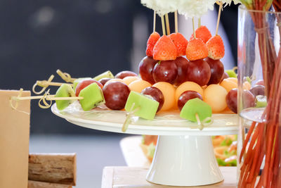 Close-up of fruits in plate on table