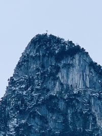 Low angle view of rock formation against clear sky