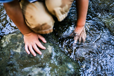 Boy outdoors in shallow water