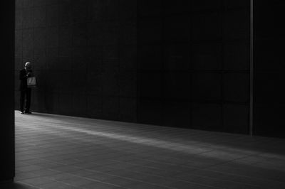 Man standing on floor in building