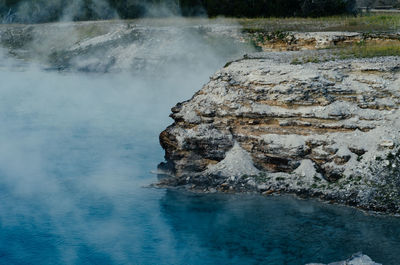 Close-up of rock on water