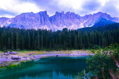 Scenic view of lake and mountains against sky