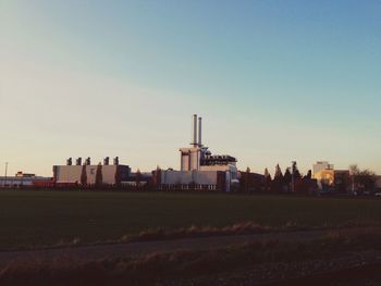 View of buildings in field