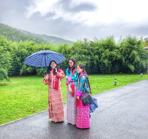 People in traditional clothing against sky