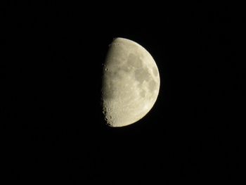 Low angle view of moon against clear sky at night