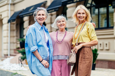 Portrait of female friends standing outdoors