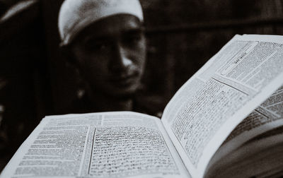 Portrait of man reading book