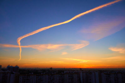 Silhouette buildings against sky during sunset