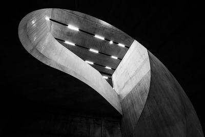 Low angle view of illuminated building against sky at night