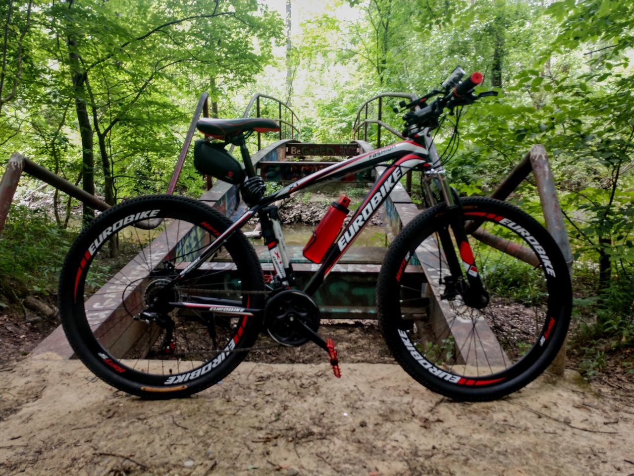 tree, bicycle, forest, transportation, day, mode of transportation, land, plant, no people, nature, land vehicle, outdoors, woodland, stationary, absence, wheel, non-urban scene, travel, landscape, field, tire