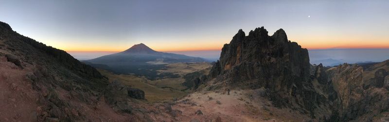 Scenic view of mountains at sunset