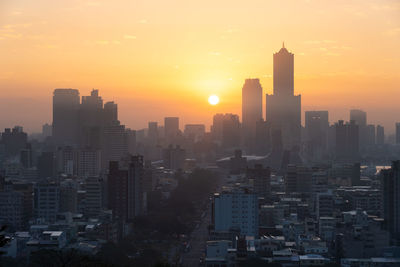 Cityscape against sky during sunset