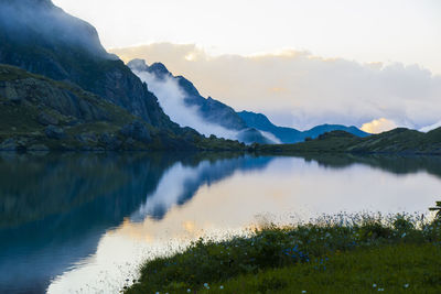 Mountain lake and fog, misty lake, amazing landscape and view of alpine lake okhrotskhali 