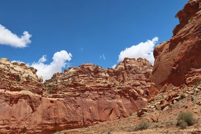 Low angle view of rock formations against sky