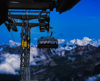 Overhead cable car against sky during winter