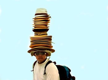 Low angle view of man standing against clear sky