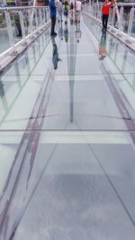 Low section of people walking on floor