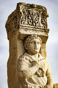 Low angle view of statue against sky