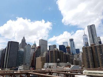 View of skyscrapers against cloudy sky