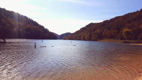 Scenic view of calm lake against mountain range