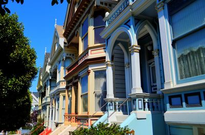 Low angle view of buildings against blue sky