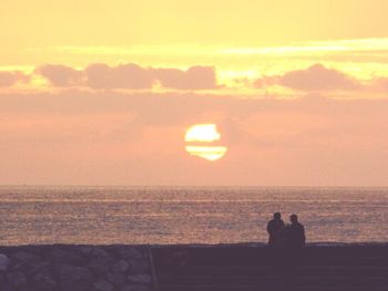 Scenic view of sea at sunset
