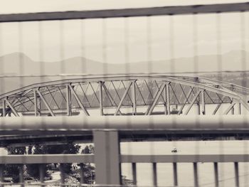 Bridge over river against sky