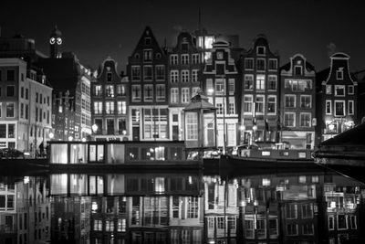 Buildings in city at night