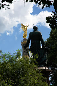 Low angle view of statue against sky