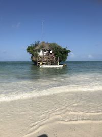 Scenic view of beach against clear sky