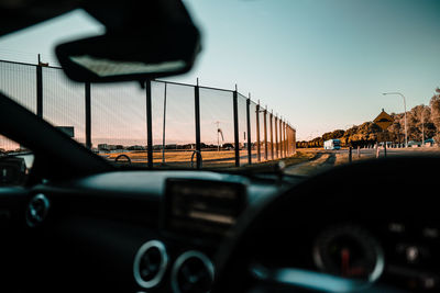 Cars on road seen through car windshield