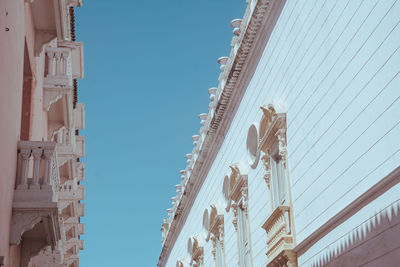 Low angle view of building against clear blue sky