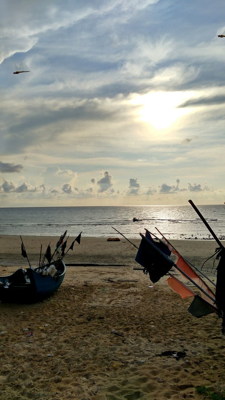 nautical vessel, sea, transportation, mode of transport, water, boat, sky, horizon over water, moored, cloud - sky, scenics, beach, beauty in nature, tranquil scene, tranquility, nature, travel, cloud, sunlight, sunset