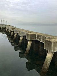 Pier over sea against sky