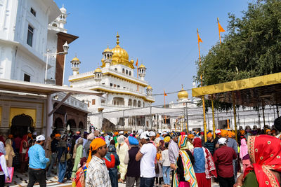 Unidentified devotees from various parts at golden temple - harmandir sahib in amritsar, punjab
