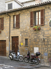 Bicycles on street against building