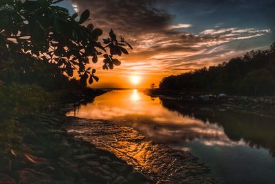 Scenic view of lake against sky during sunset