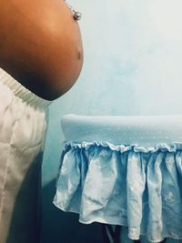 Close-up of woman hanging in kitchen at home