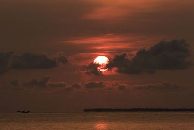 Scenic view of sea against sky at sunset