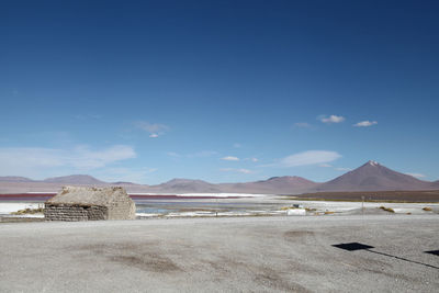 Scenic view of mountains against blue sky
