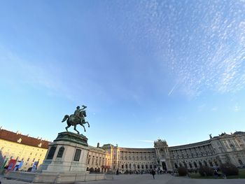 Low angle view of statue against sky