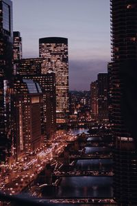 Illuminated buildings in city at night