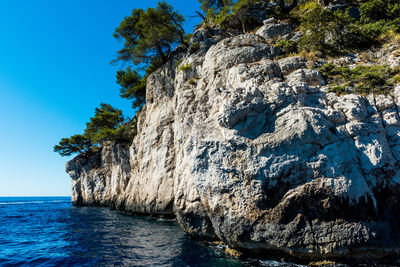 Scenic view of sea against clear blue sky