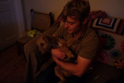 Young woman with dog at home