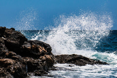 Water splashing on rocks at sea shore