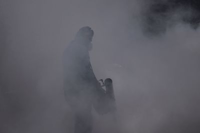 Man standing on snow against sky