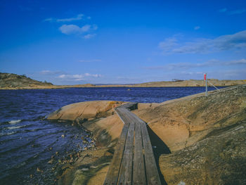 Scenic view of sea against blue sky