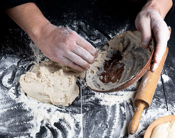 Cropped hands of chef preparing food