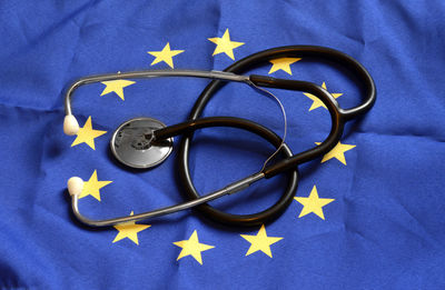 Close-up of stethoscope on european union flag