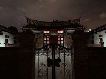 Low angle view of illuminated building against sky